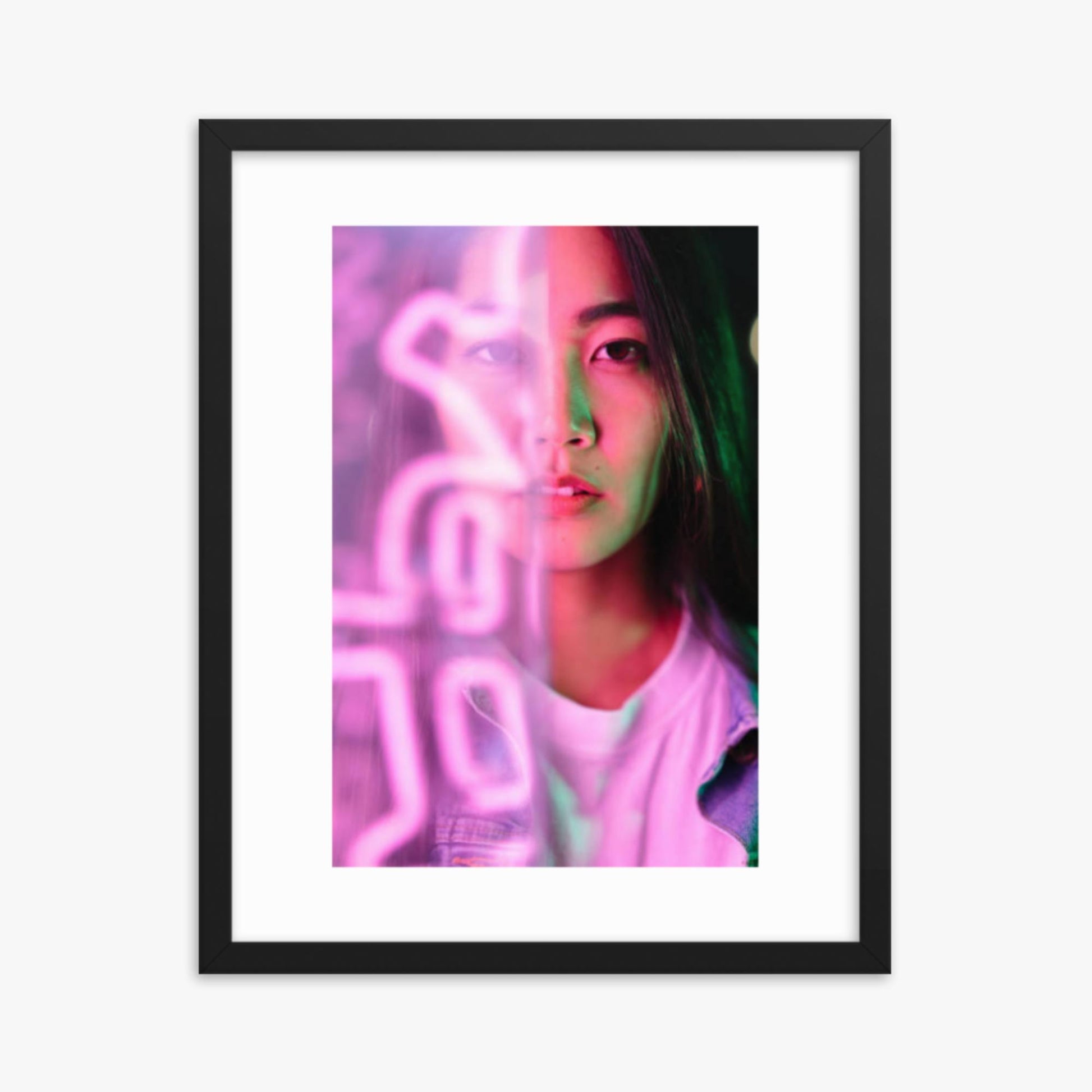 Portrait of young woman lit by pink neon light 16x20 in Poster With Black Frame