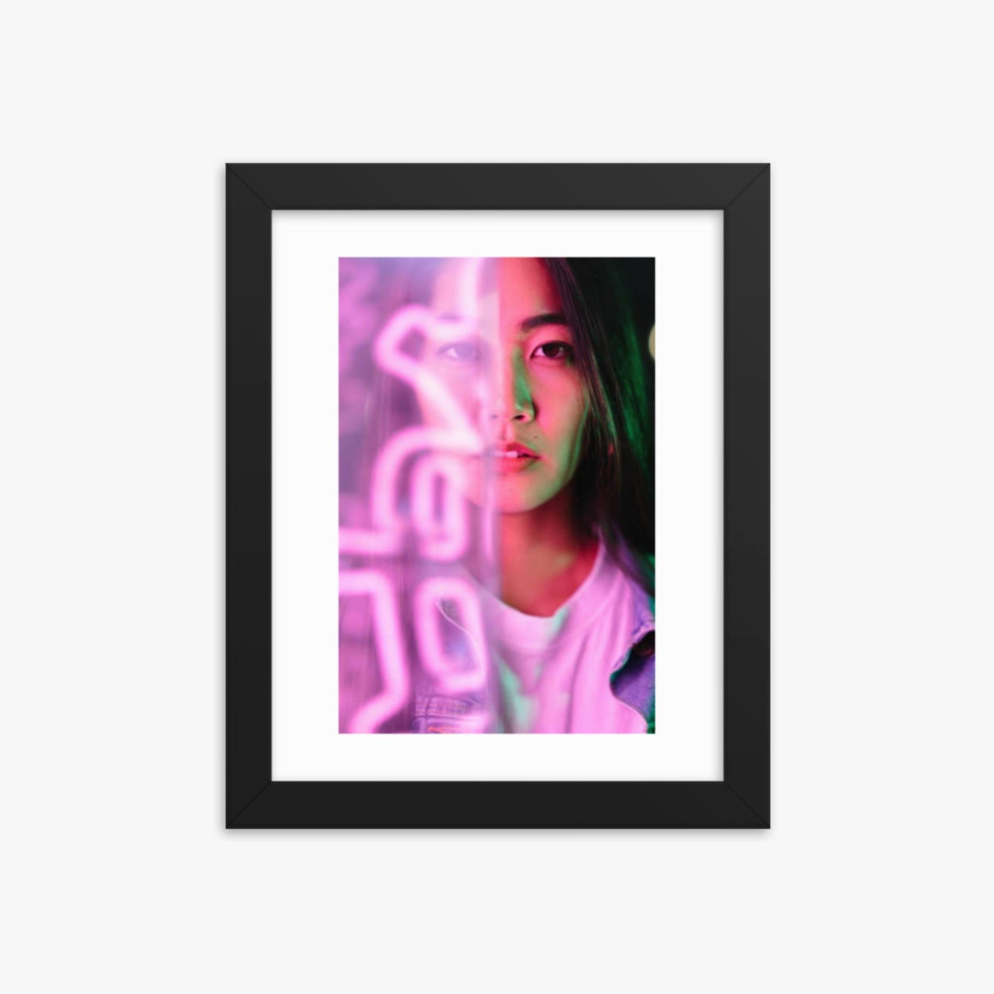 Portrait of young woman lit by pink neon light 8x10 in Poster With Black Frame