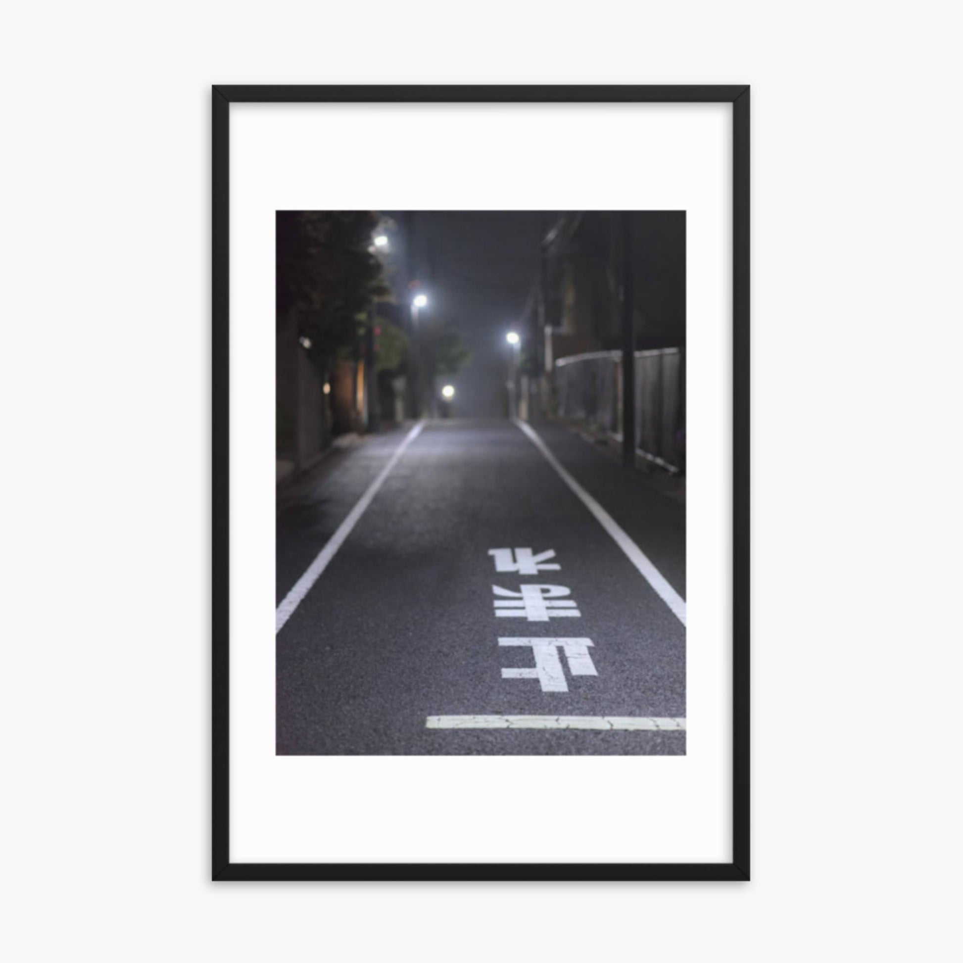 Typical road by night with the stop sign in Japanese written on the ground 24x36 in Poster With Black Frame