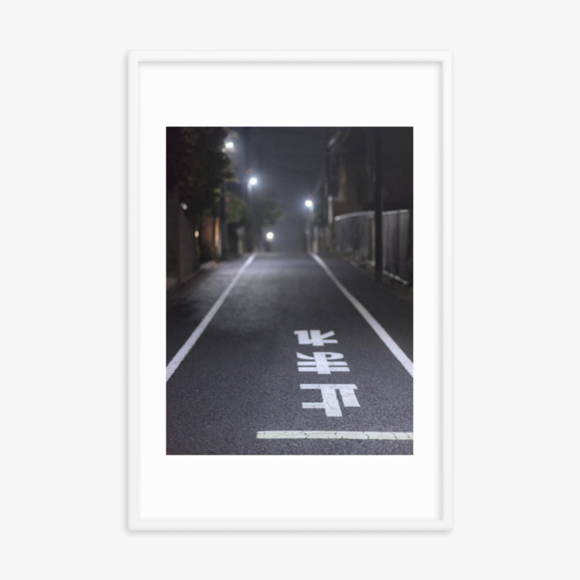 Typical road by night with the stop sign in Japanese written on the ground 24x36 in Poster With White Frame